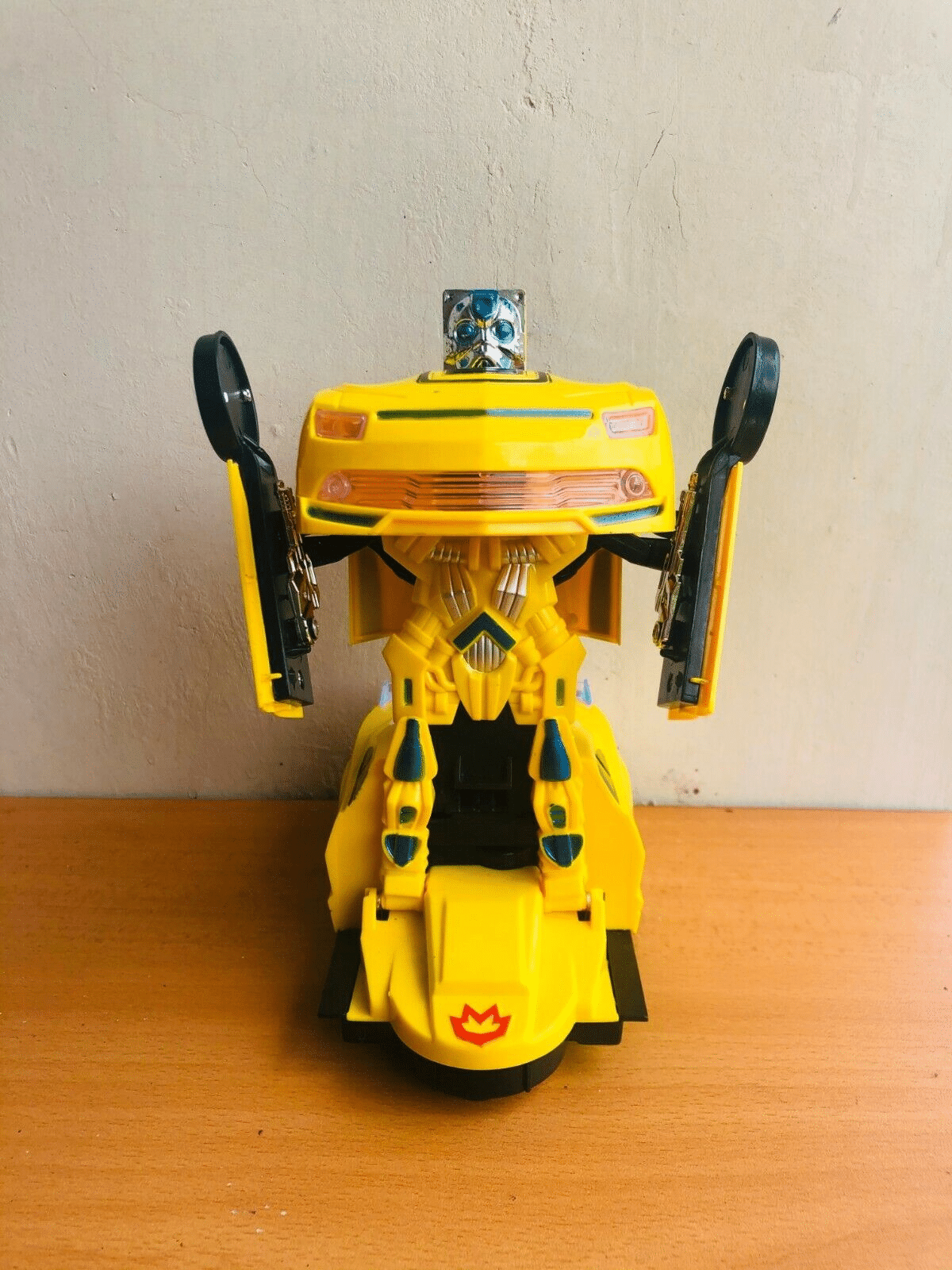 Uttam Toys Robot To Car Converting Transformer Toy with Light and Sound for Kids (Yellow)